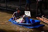 Thailand, Locals sell fruits, food and products at Damnoen Saduak floating market near Bangkok 